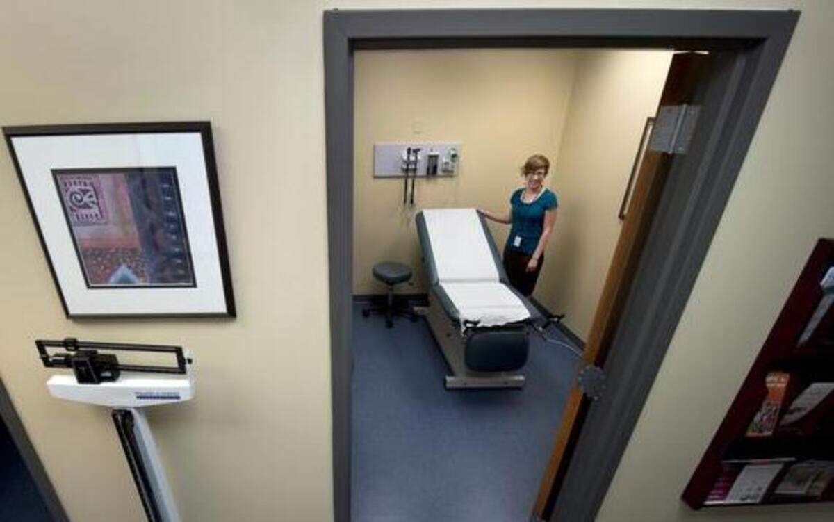 
Marketing manager Sharla Nolte shows off the exam room in the new clinic at the Rose Brooks Center. 
