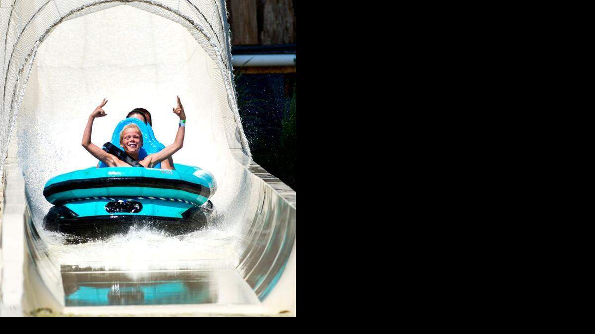 
Chris Reeves, 13, of Gilbert, Ariz., his father and his twin brother made Schlitterbahn one of the last stops on their trip so they could ride Verrückt. Chris raised his arms in triumph at the end of the slide Thursday.
