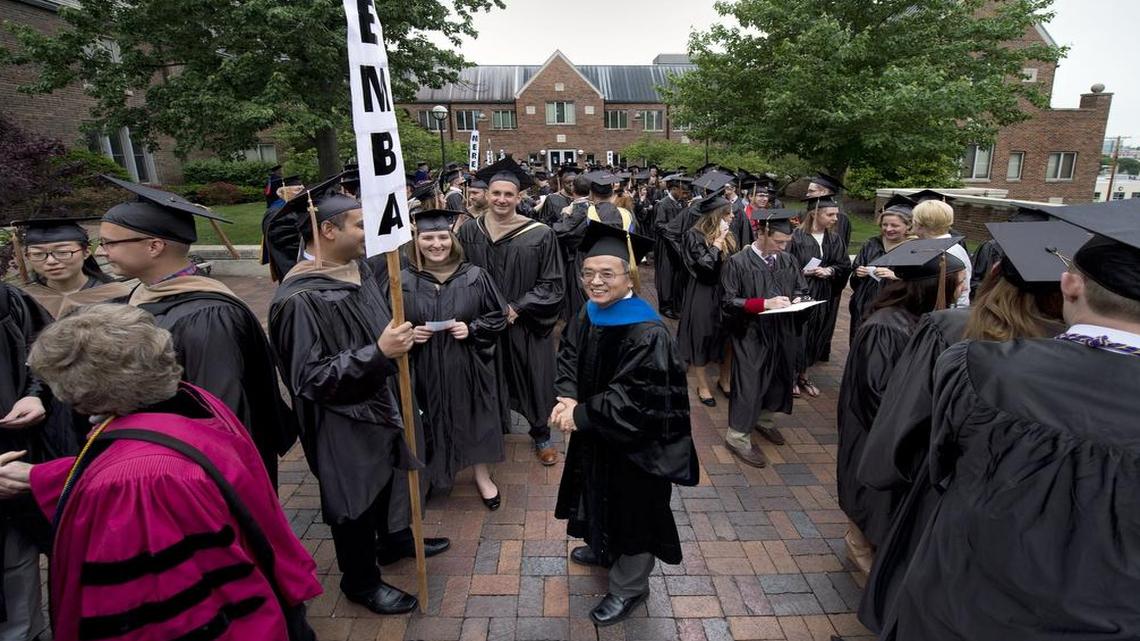
At the spring 2014 commencement for the Henry W. Bloch School of Management at the University of Missouri-Kansas City, Michael Song (center) stood with graduates as they gathered at the school before their procession.
