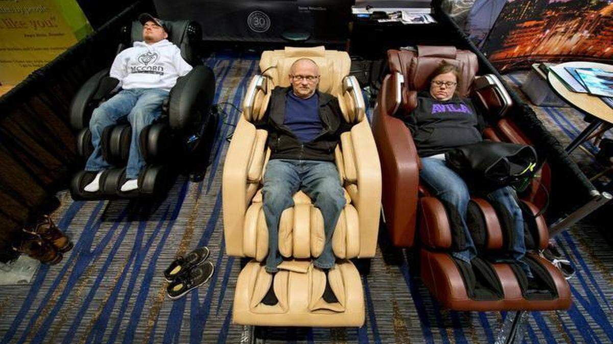 
The Johnson County Home & Garden show wrapped up Sunday at the Overland Park Convention Center. It was a family affair for Charlie McCord (left); his wife, Mary McCord; and her father, Tom Weller, as they tested massage loungers at the Daiwa booth.
