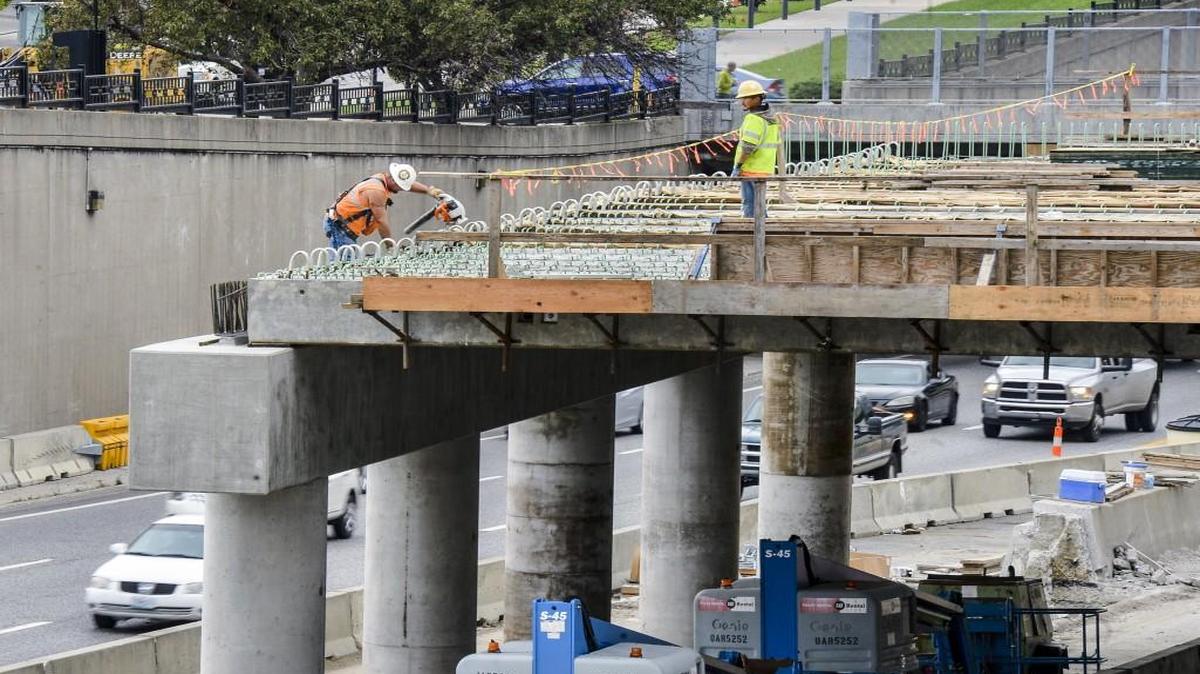 Work continued Friday on the new Grand Boulevard bridge as crews prepared to install the second half of the girders this weekend. The girders make up the core of the bridge, which is being replaced after falling into disrepair earlier this year.