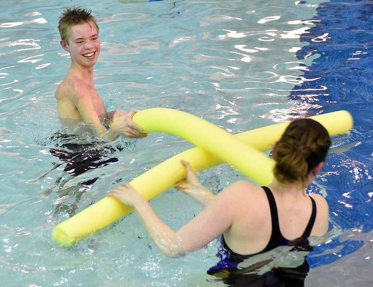 This was Billy Sticklen of Joplin, Missouri when he was 13 and recovering from acute flaccid myelitis, or AFM, a rare neurologic condition, at Children’s Mercy in 2014. He worked in a pool with occupational therapist Kelly Grabendike.