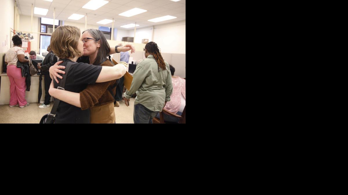 
Emily Gavin and Eliza Callard kissed after getting their marriage license Wednesday at the Register of Wills at City Hall in Philadelphia.
