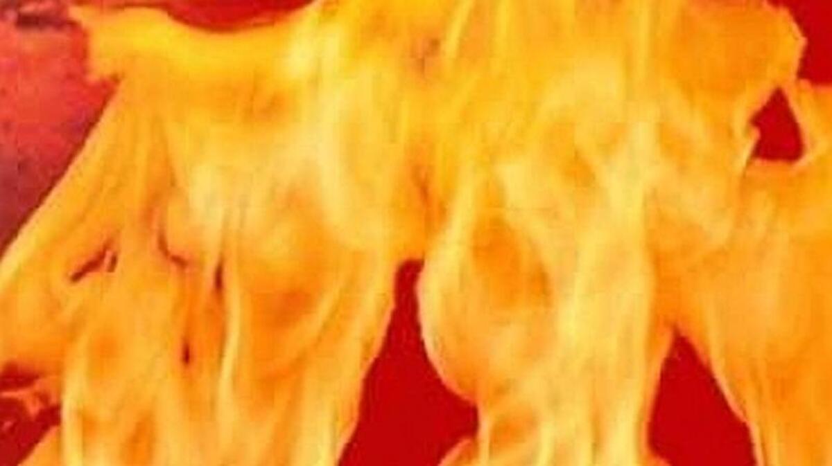 Emergency crews rushed a woman to a hospital after firefighters pulled her from a burning house early Wednesday morning in Kansas City.
