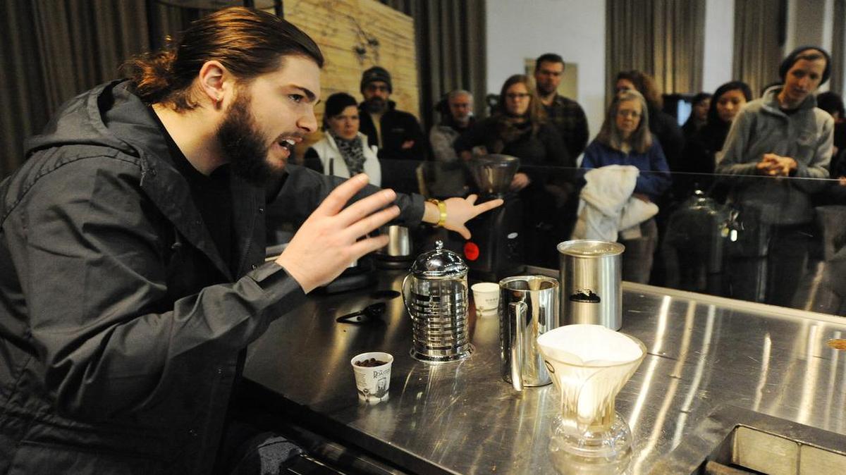 Tour guide Gage Barton explained the process of using a French press to get the most flavor from Roasterie coffee to a tour group Saturday morning at 1204 W. 27th St. in Kansas City.