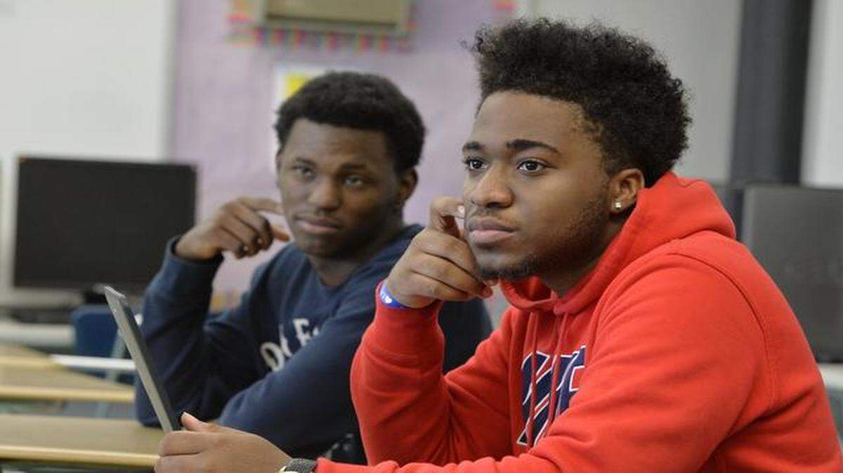 
Center Alternative School teacher James Bridgeford II and three of his advisory class students were part of a conversation with Kansas City police officers about how teens should react when they have an encounter with police. Two of the students were Corey Smith (left) and Tyrese Gully.
