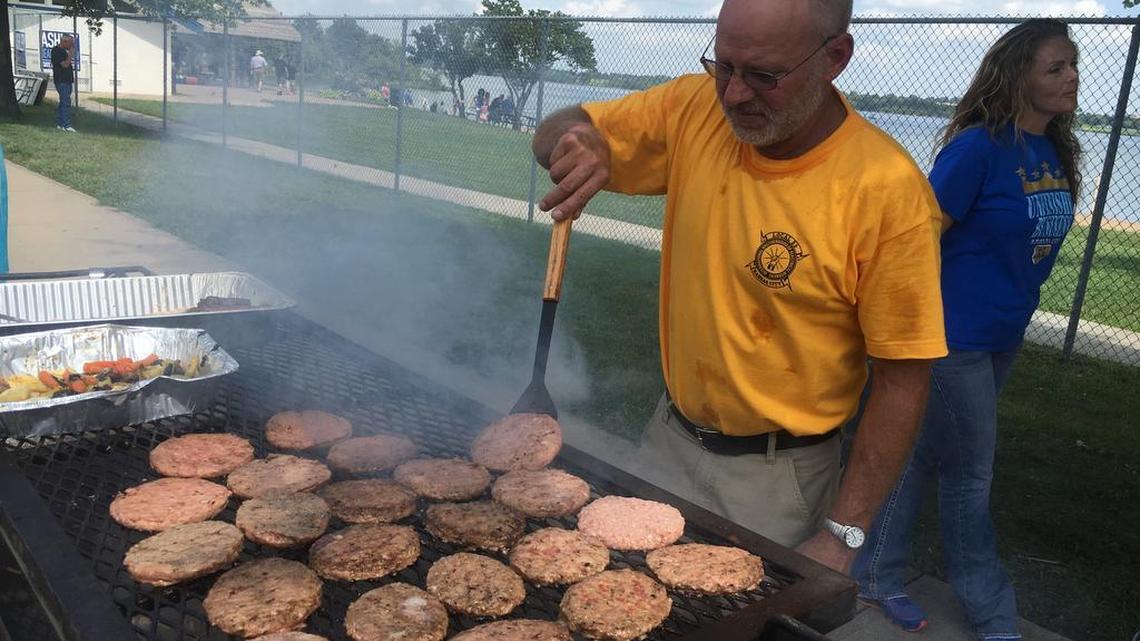 Kyle Neuenschwander, a union member with IBEW Local 53, grilled for labor workers Saturday.