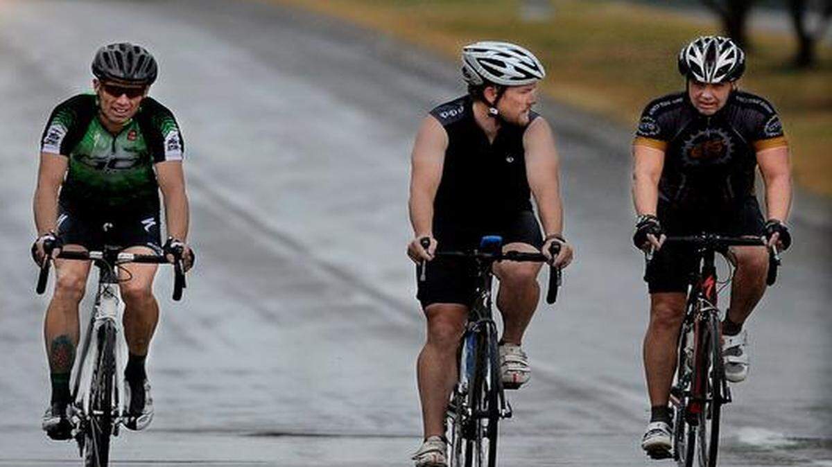 
From left, Roger Williams, of Lawrence Kenny Carlson of Gardner and Bud Middleton of Overland Park endured a soggy 70-mile, three-hour ride during Sunday's 12th Annual Sunflowers to Roses Bike Tour. The event, which raises money and awareness to fight cancer and promotes cycling as a safe recreational family activity, began and ended at The Bike Source near 135th Street and Quivira in Overland Park.
