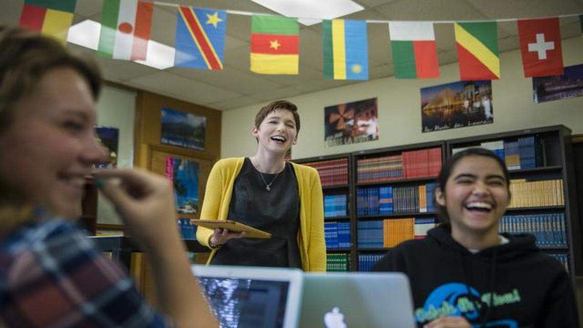 
Shawnee Mission South High School teacher Rebecca Haden (center) laughs with senior Sidney Holler (left) and sophomore Cinthia Romo while teaching an advanced French class. As policymakers and education experts debate the state of U.S. education, one area of concern is the preparation and support of first-year teachers like Haden.
