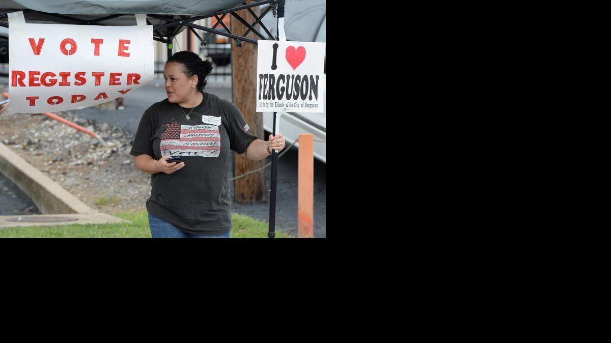 
Shiron Hagens of St. Louis sought to register voters at a rally Saturday in Ferguson, Mo., near the site where Michael Brown, an unarmed black 18-year-old, was fatally shot by a white police officer three weeks earlier.
