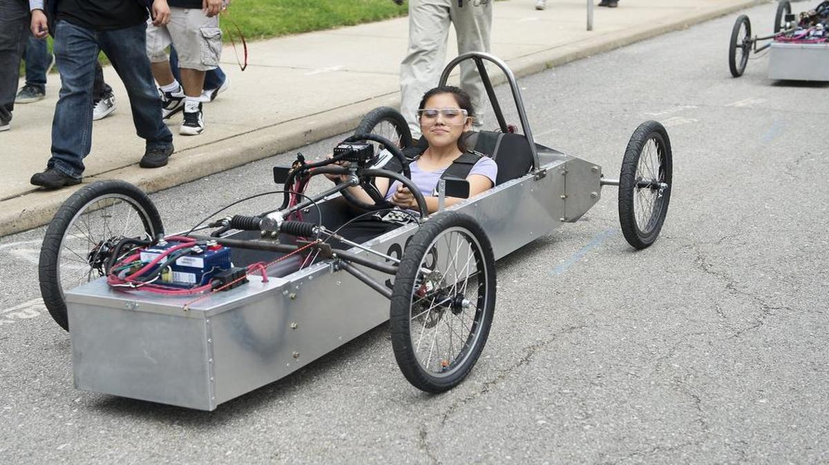 
After a test drive this month, students in the Minddrive program, including Britany Mojica (left) and Jesus Rodriguez, both 16-year-old students at Alta Vista Charter High School in Kansas City, drove electric cars back to the Minddrive headquarters at 2615 Holmes St. Students in the program spend about 30 weeks planning, designing, building and testing their electric cars and other projects. In July, Minddrive students will travel with mentors and staff to race the cars at Road America, near Elkhart Lake, Wis.
