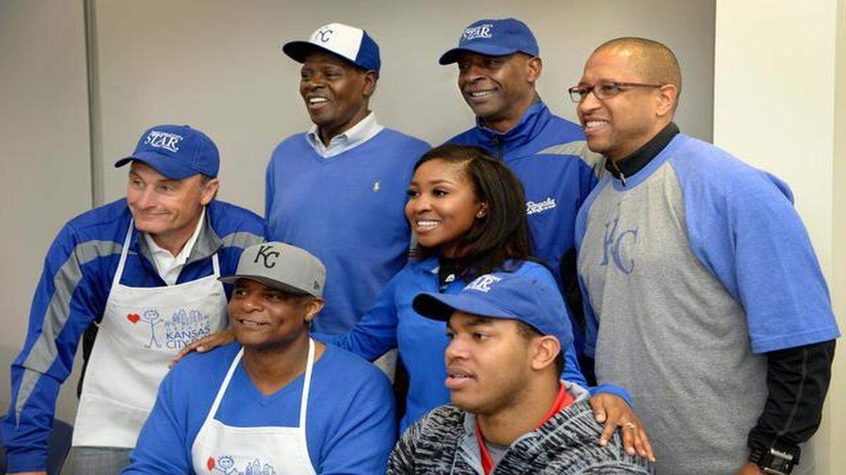 
Jasmine Walker (center) got a Greater Kansas City Day photo on Monday at The Kansas City Star Press Pavilion. Among those in the shot were Jim Eisenreich, Warren Moon, John Mayberry, Willie Wilson and Eddie Kennison.
