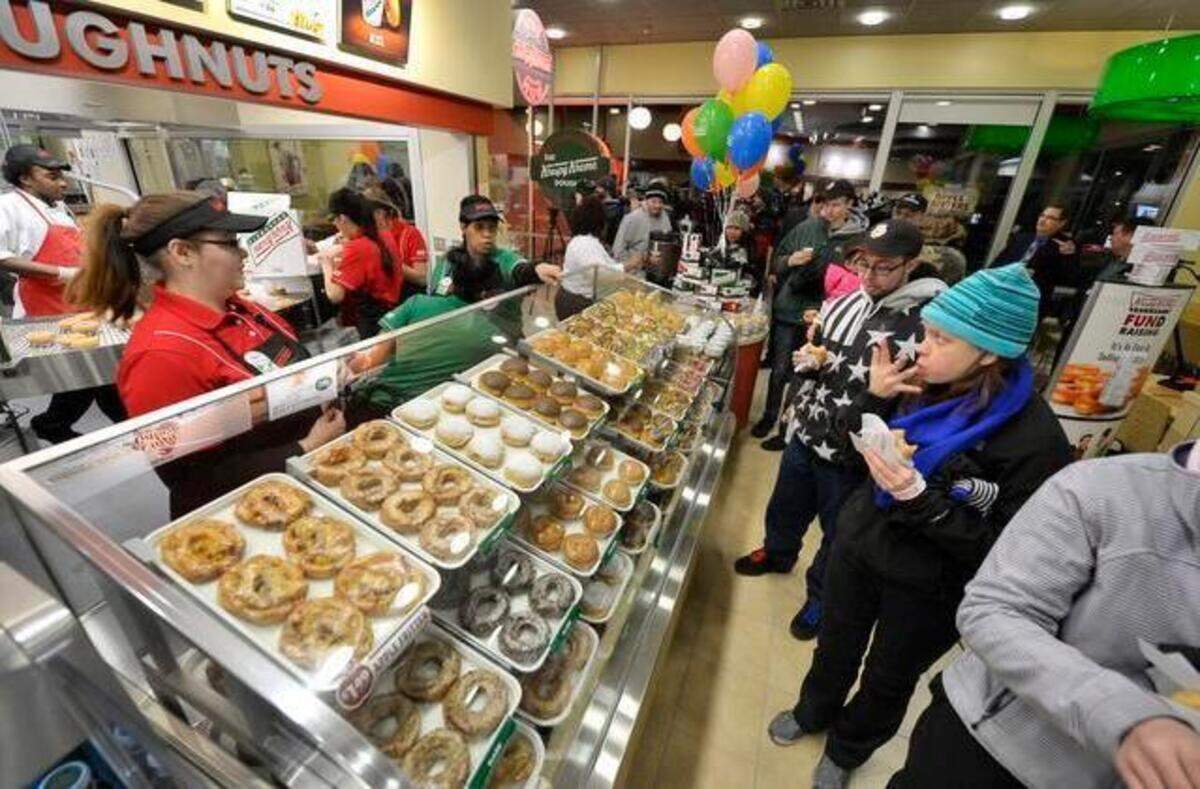 
Krispy Kreme Doughnuts opened their 1,000th story early Tuesday, Feb. 24, 2015, at 7648 State Avenue in Kansas City, Kan. Customers, some who had been waiting since Monday afternoon, filled the store after the doors were opened at 6 a.m.
