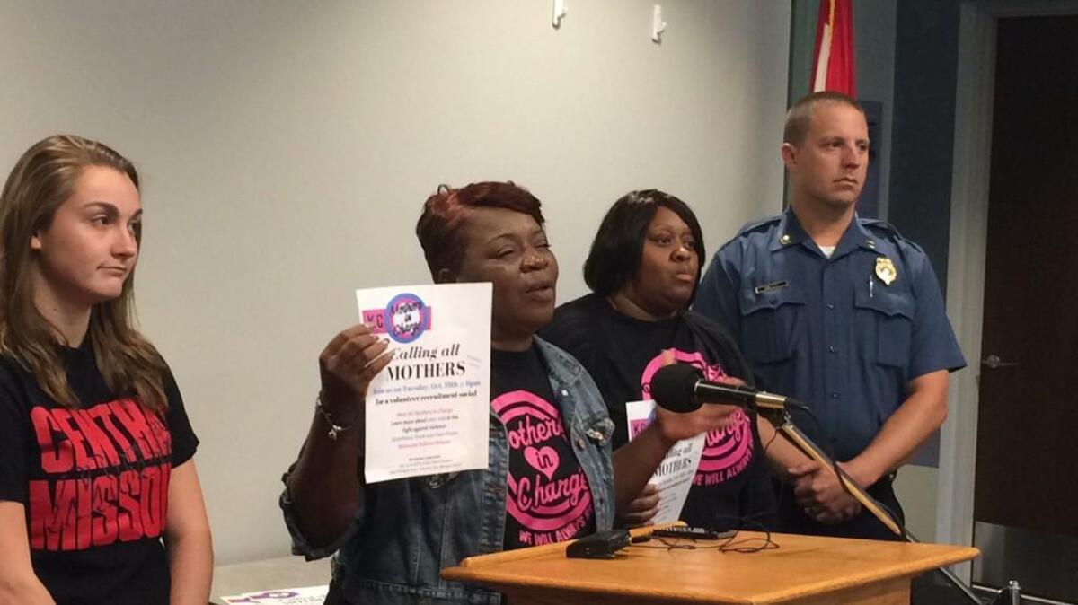 Rosilyn Temple with Mothers in Charge solicits women to join their crime prevention group.