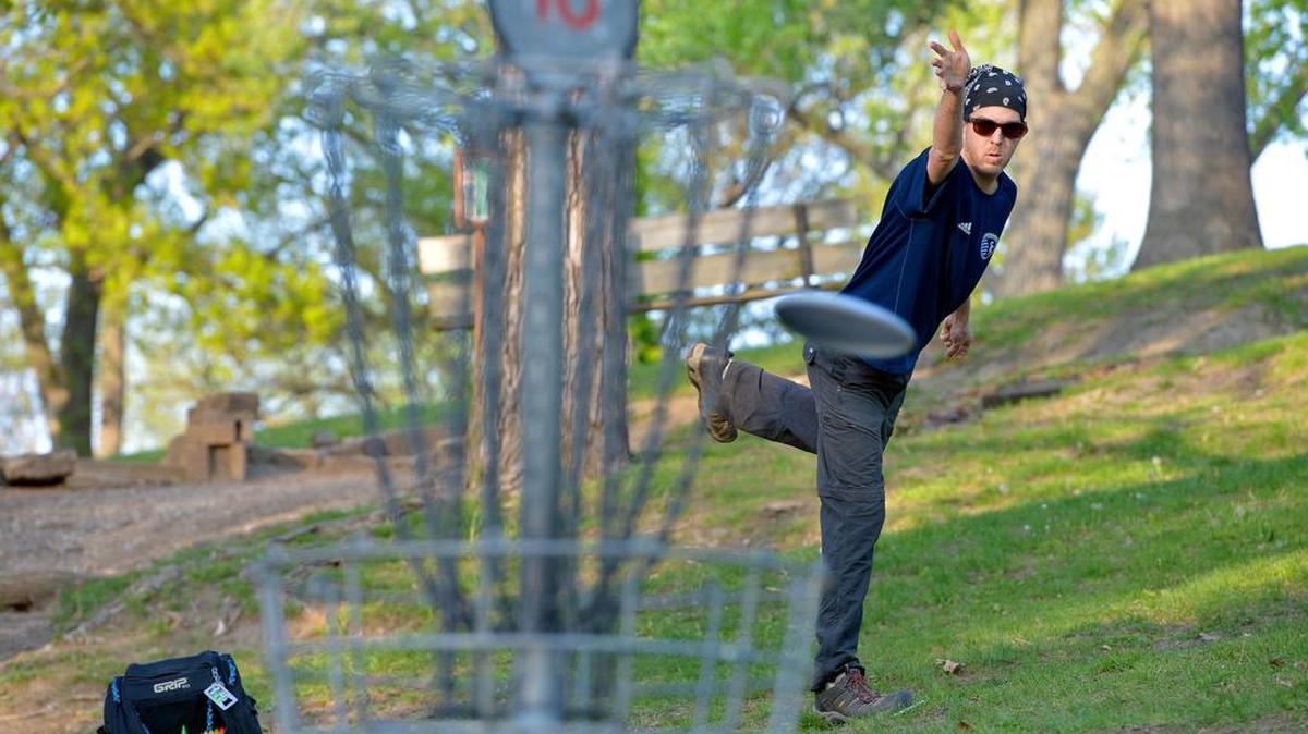 Disc golfer Greg Utz aims for the basket in this 2015 photo.