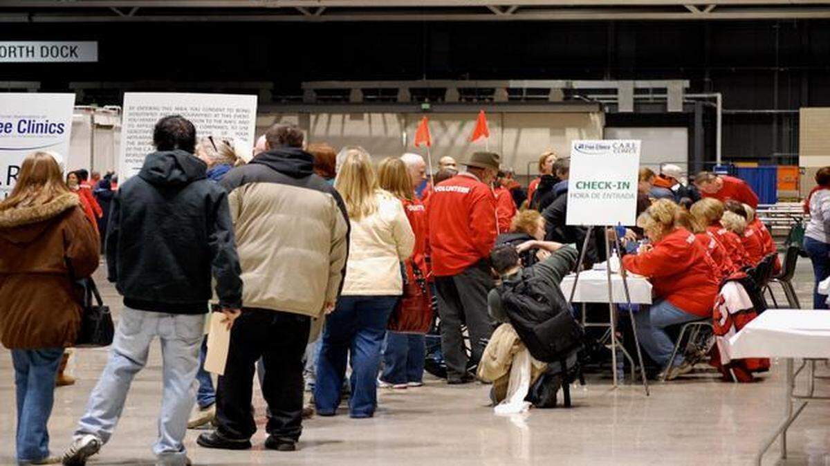 
People waited in line to check in at a free health care clinic held at Bartle Hall in Kansas City in 2009. The National Association of Free & Charitable Clinics is returning to Bartle Hall with another one-day free health clinic on April 18.
