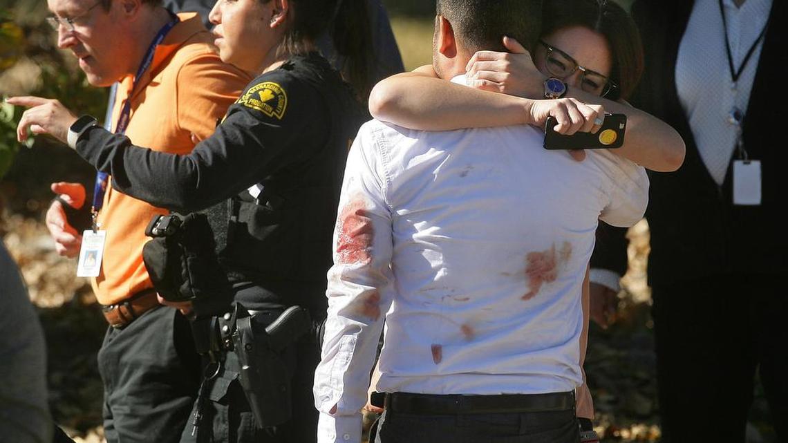 A couple embraced following a shooting that killed 14 people at a social services facility Wednesday in San Bernardino, Calif.