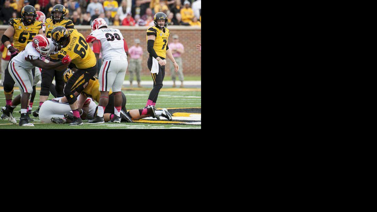 
Missouri quarterback Maty Mauk, right, watches the action as his fumble is recovered by Georgia during the second quarter of an NCAA college football game Saturday, Oct. 11, 2014, in Columbia, Mo. 
