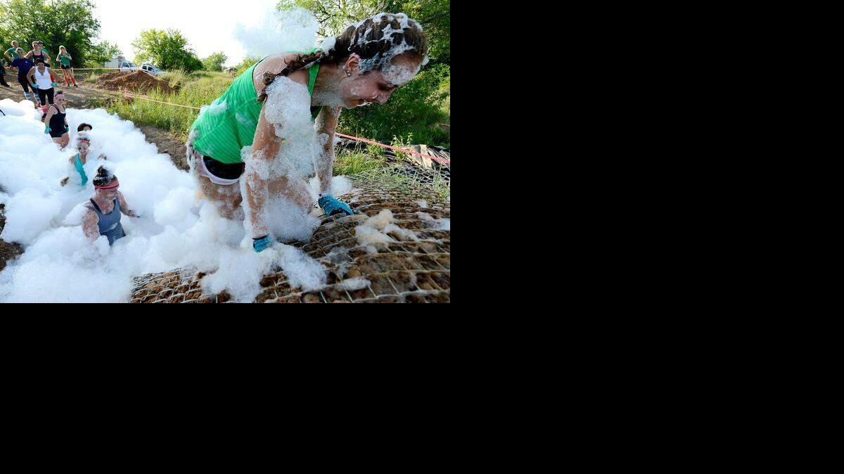 
Kelsey McConnell of Kansas City led her team of “Tough Broads” in and then out of the foam pit during the Wild Women Timber Challenge on Sunday morning. The 5K event was held in Bonner Springs.
