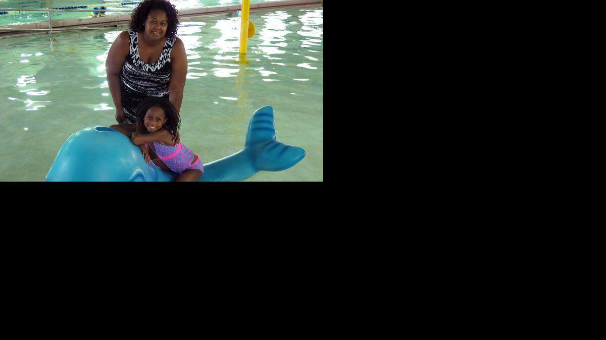 
LaShana McGee of Piper, Kan., never learned to swim as a child, but she has made learning to swim a priority for her two daughters. Her 9-year-old daughter, KayLynn, takes swimming lessons at the Providence YMCA/Ball Family Center in Kansas City, Kan.
