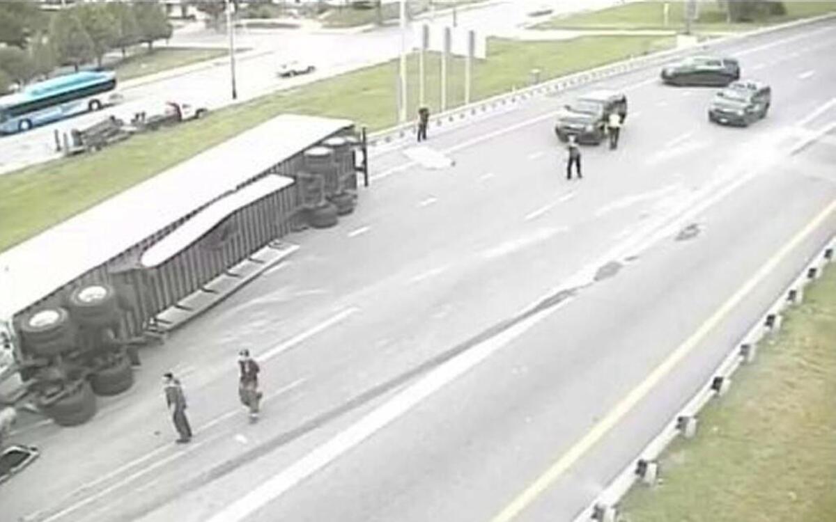 The westbound lanes of the north side of Kansas City’s downtown loop were closed Thursday afternoon after a tractor-trailer overturned.