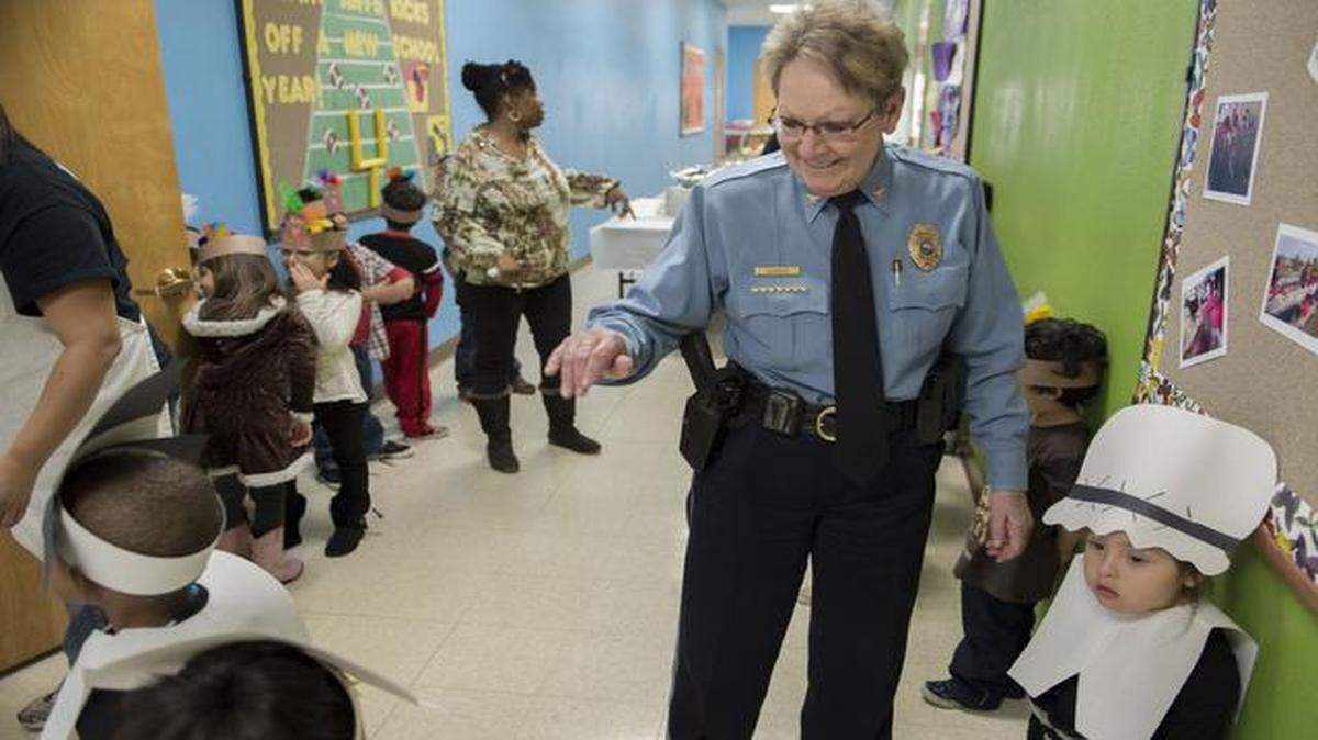 
Police Chief Ellen Hanson waved Tuesday as she visited with kids before they took the stage for the Thanksgiving program at El Centro’s Academy for Children in Kansas City, Kan.
