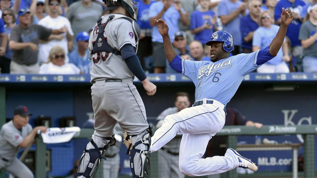 
Kansas City Royals' Lorenzo Cain (6) scores in front of Cleveland Indians catcher Roberto Perez (55) on a double by Eric Hosmer in the fourth inning during Sunday's baseball game on September 27, 2015 at Kauffman Stadium in Kansas City, Mo.
