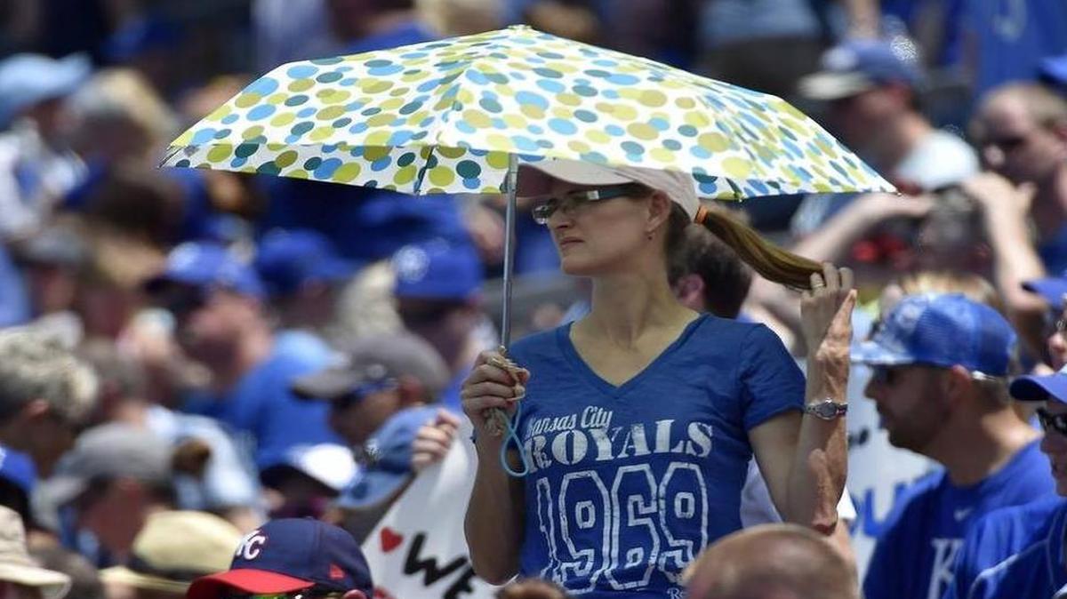 
Kansas City Royals fans were keeping covered from the sun during Sunday's baseball game against the Toronto Blue Jays at Kauffman Stadium in Kansas City.
