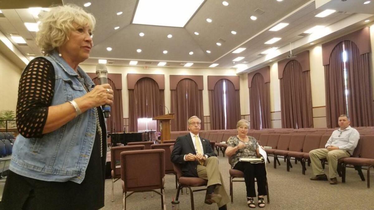 Sheila Tracy, left, president of the Northland Regional Chamber of Commerce, addressed the crowd at a town hall meeting Tuesday in the Northland to discuss the future of Kansas City International Airport.