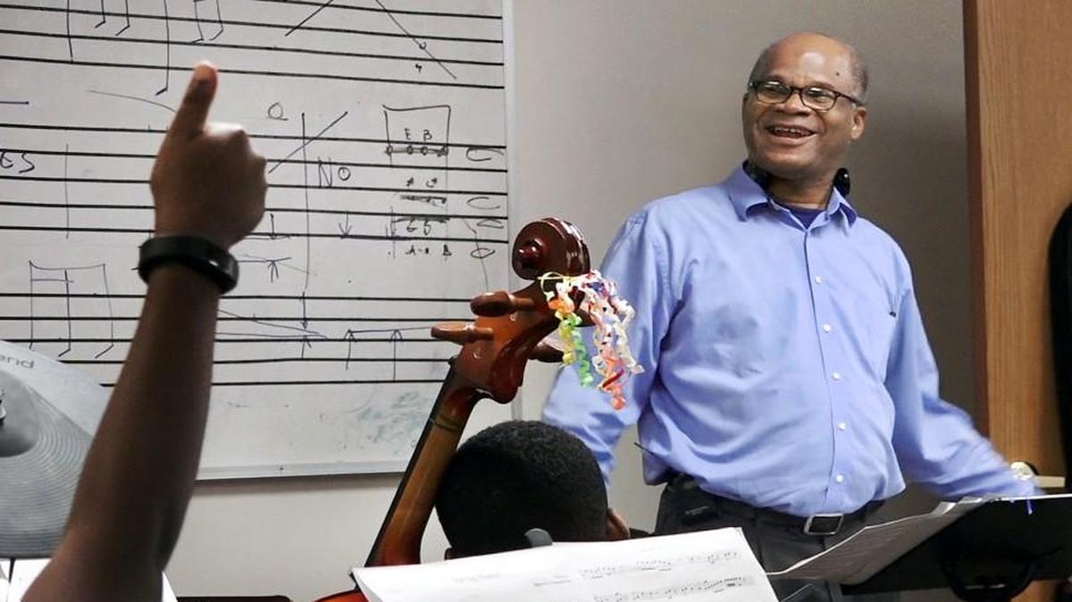 Darryl Chamberlain got a thumbs-up from one of his students at a practice session for the St. James United Methodist A-Flat Youth Orchestra. They were at the church, 5540 Wayne Ave.