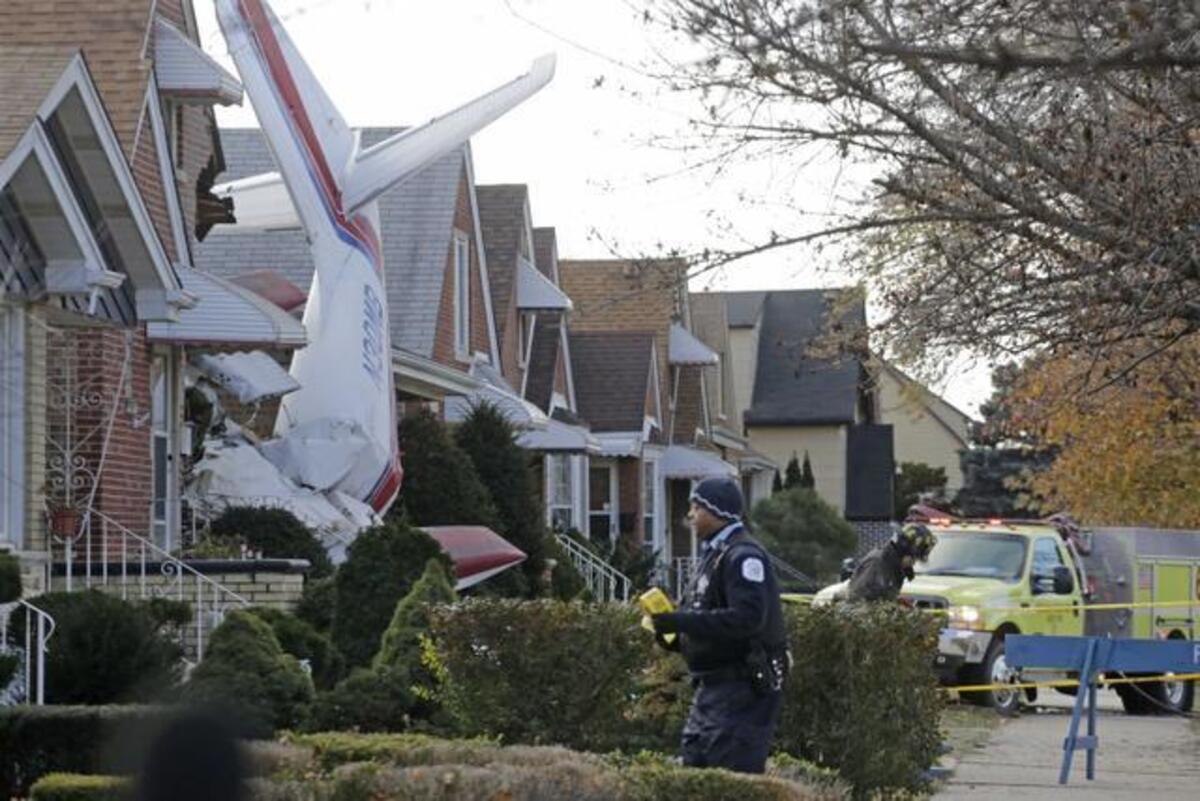 
Police and fire officials investigated the scene in Chicago near Midway Airport after a small, twin-engine cargo plane registered in Fairway crashed into a home early Tuesday. The plane was registered to Central Airlines. The pilot was killed in the crash.
