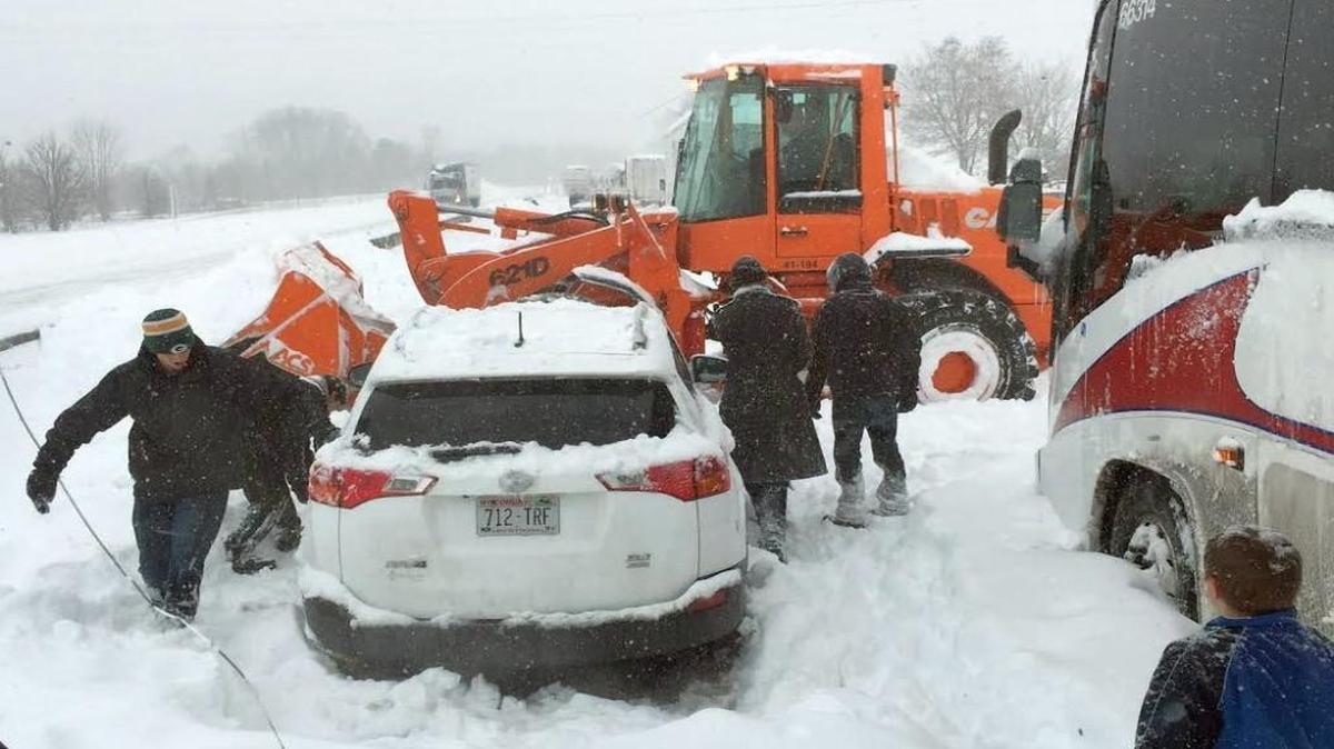 The view from the front of a bus carrying Kansas City area residents on the Pennsylvania Turnpike on Saturday showed a snow plow trying to clear a lane for passenger cars to escape a huge backlog caused by a massive winter storm.