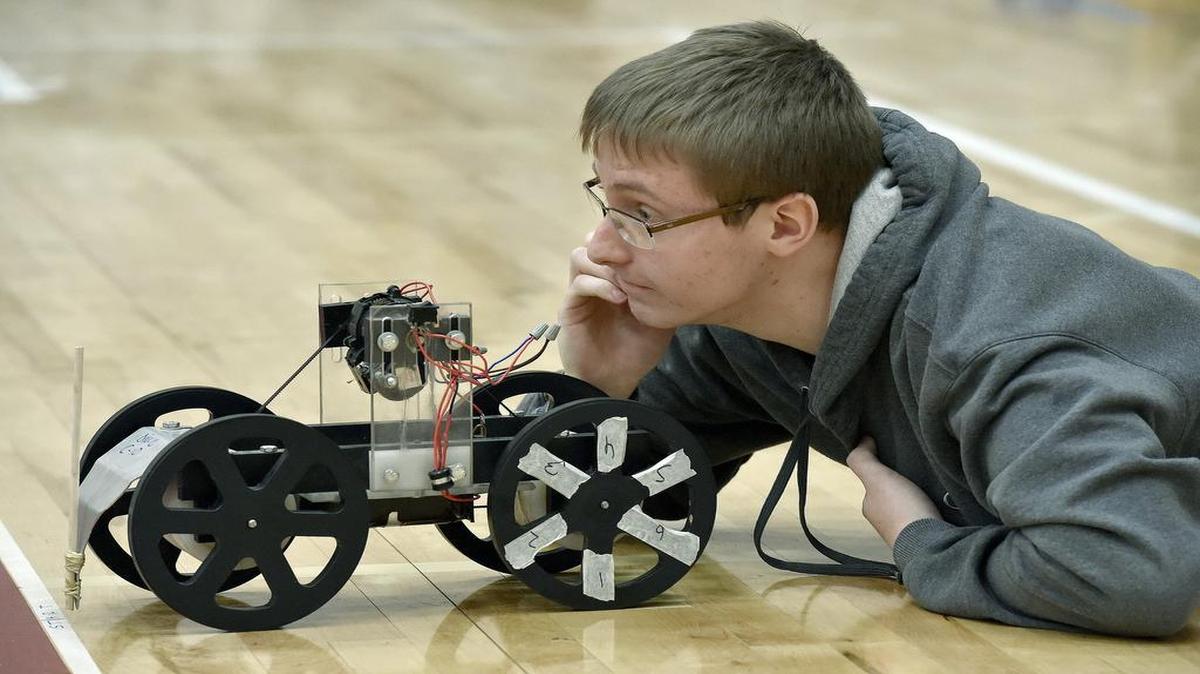 Jacob Vanderpool of Lathrop High School lined up his team’s electric vehicle on the course during Saturday’s regional Science Olympiad at Metropolitan Community College-Penn Valley.