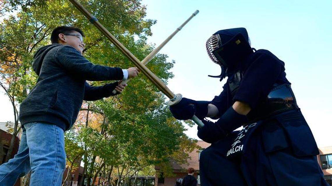 Aiden Reese (left), 11, took a turn sparring with James Balch, a member of the Kansas City Kendo Club, during a past Greater Kansas City Japan Festival at Johnson County Community College.