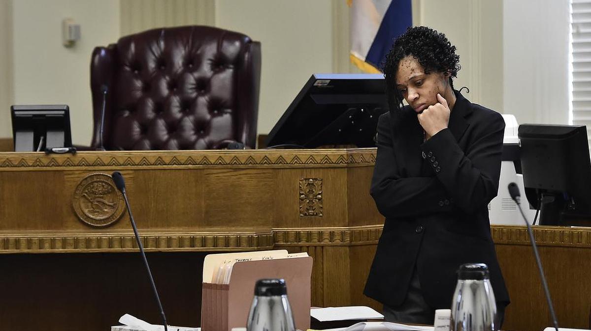 Jacole Prince, the mother of LP, a 10-year-old girl discovered locked in a closet surrounded by her own waste who weighed 32 pounds at the time, appeared in Jackson County Circuit Court Monday, Nov. 16, 2015. During a break, Prince stands alone and pauses near the bench.