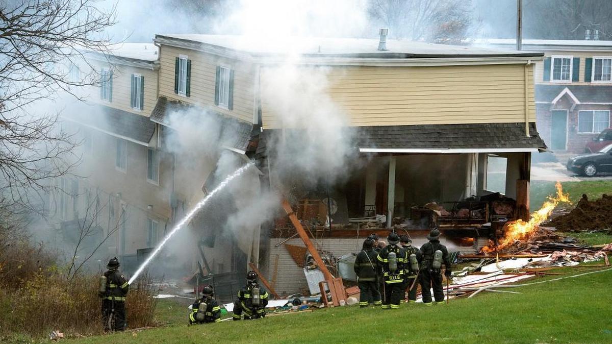 Kansas City fire crews responded Tuesday after a car trying to flee police crashed into an apartment building in the 2000 block of Wheeling Avenue, soon causing a gas explosion that ripped off a side of the building. No one was injured, police said.
