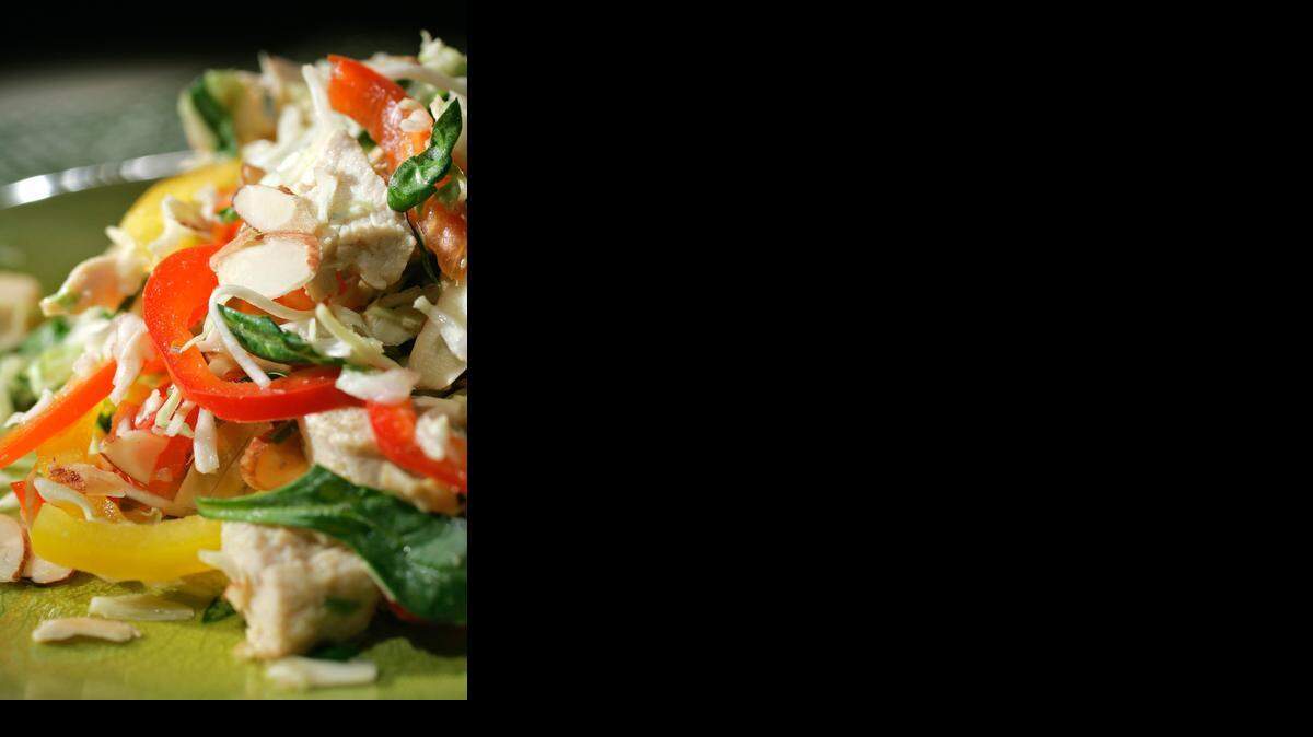 Poaching the chicken in Chinese Chicken and Cabbage salad avoids the extra fat sometimes added during cooking.