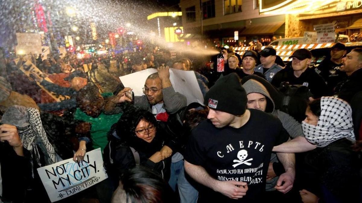 Kansas City police pepper-sprayed a crowd of protesters and journalists March 12 outside the Arvest Bank Theatre at The Midland during a rally for presidential candidate Donald Trump.