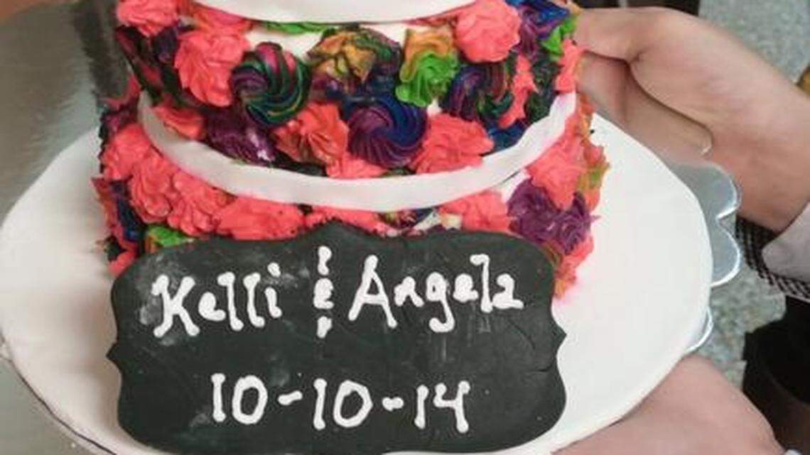 
Angela and Kelli, the first same-sex couple married in Kansas, celebrated their union with a wedding cake. 
