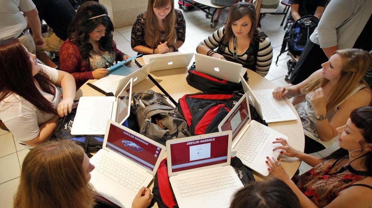Joplin High School students tried to log on to their donated laptop computers for the first time on Wednesday morning, Aug. 17, 2011, during the first day of classes at the 11th- and 12th-grade school in Northpark Mall.
