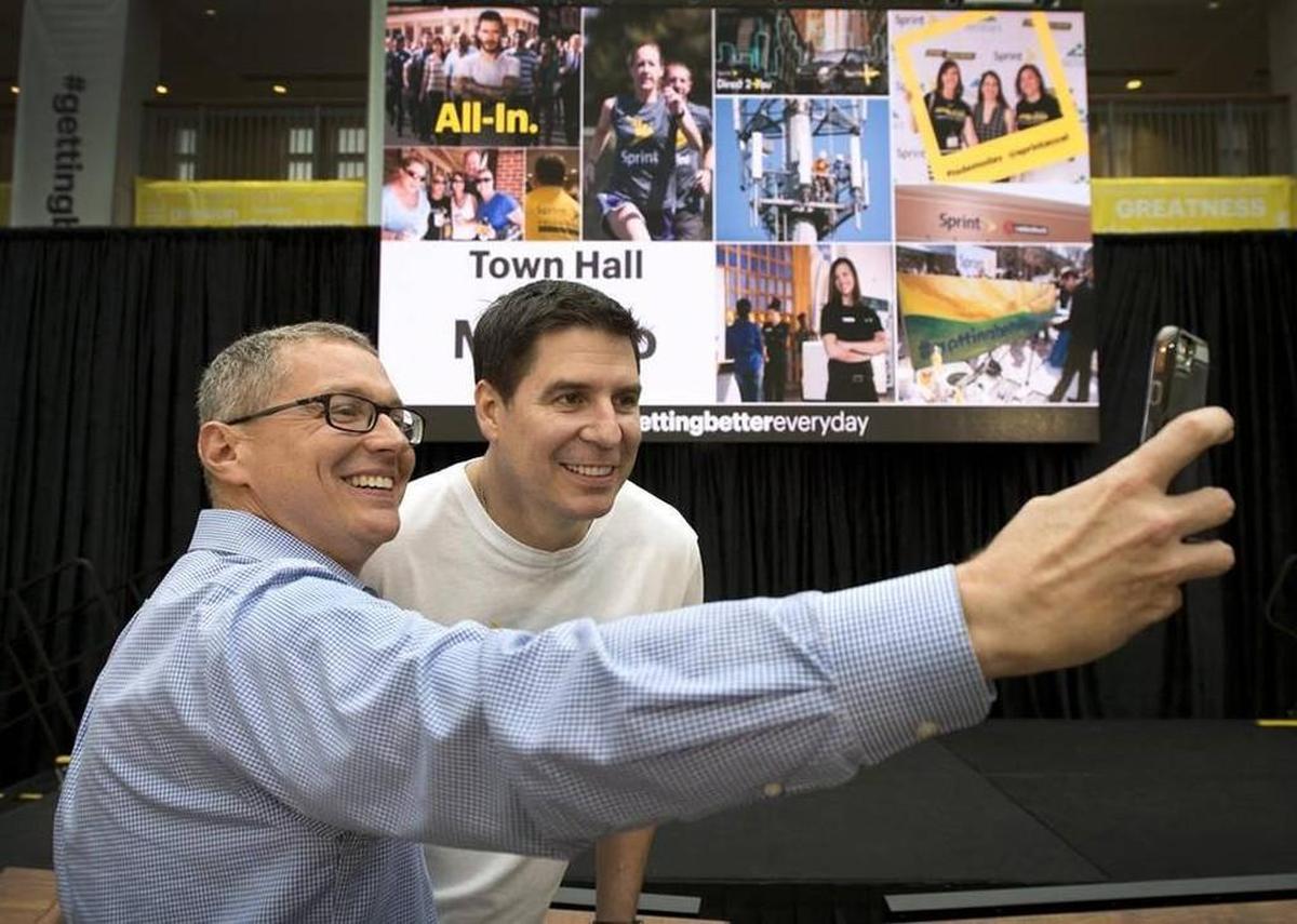 After a town hall meeting, a Sprint performance coach grabbed a selfie with Marcelo Claure.