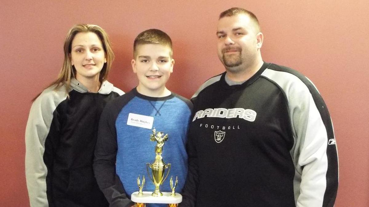 As the Cass County spelling champion, Brady Hughes will compete in the Scripps National Spelling Bee. He is pictured with his parents, Chastity and Justin Hughes.