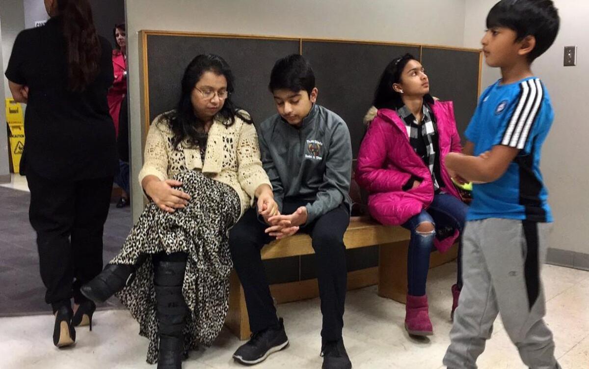 Angela Jamal (from left), and her children, Taseen, Naheen and Fareed waited inside the Platte County jail to visit Syed Jamal last month.