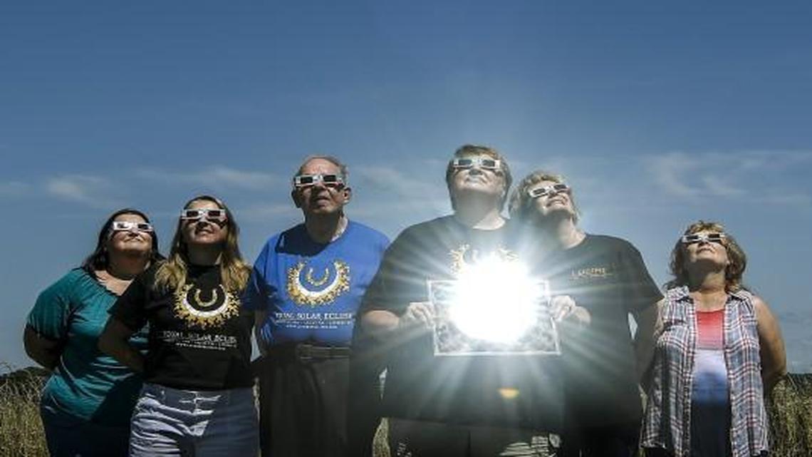 At the site of the future home of the Baptist Church of Lathrop in Lathrop, Mo., Cindy Weers (center) of the 150th anniversary and eclipse planning committee held a mirror reflecting the sun as the town of 2,200 residents prepares for the Aug. 21, 2017, total solar eclipse that will pass directly over Lathrop. From left to right are Ava Langner, Vicki Shrewsbury, Nelson Hayes, Weers, Debbie Nelsen and Coetta Whiteley.