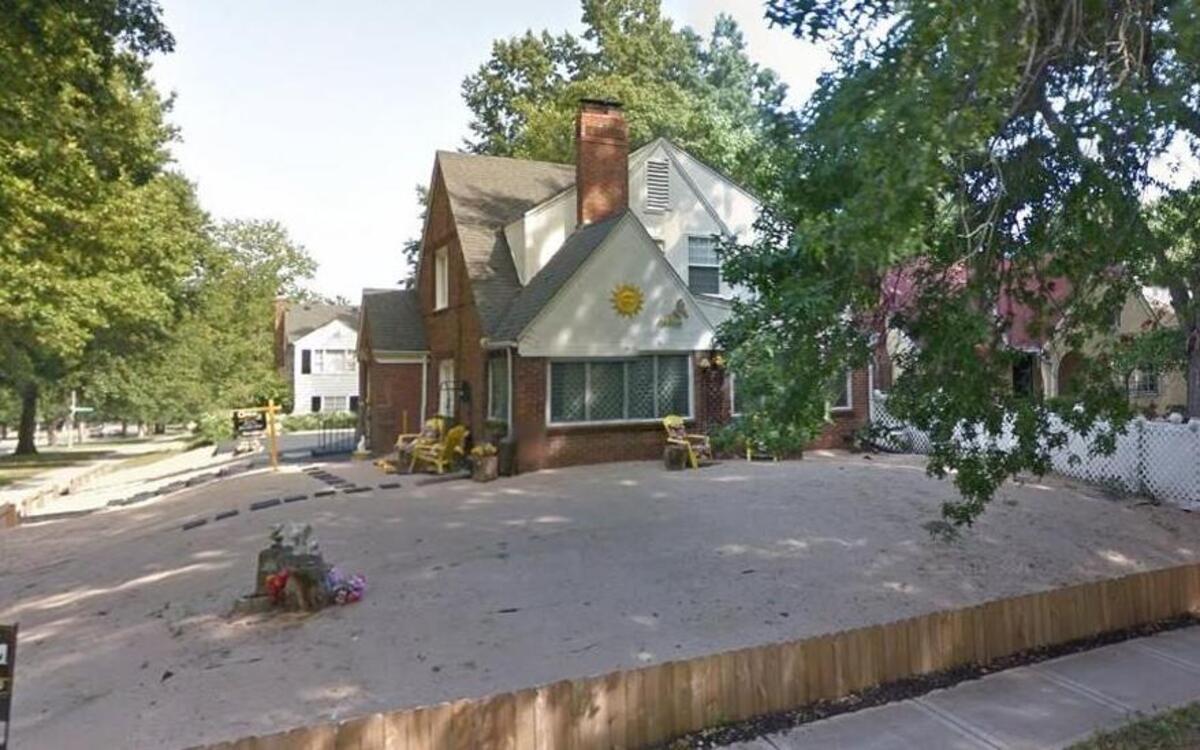 A fire Wednesday night damaged a Brookside home at Walnut Street and E. Meyer Boulevard. The house has become well-known in the neighborhood since its owner replaced the lawn with sand.
