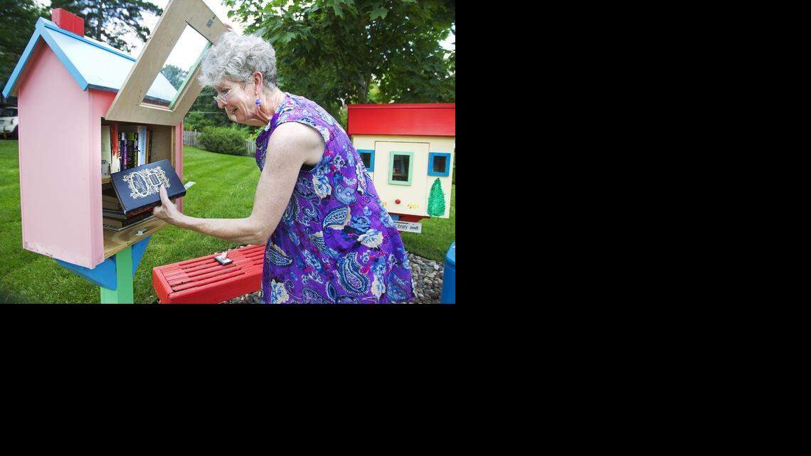 
At the Little Free Library at the home of Gwyneth Jones in Mission, she recently pulled books from the library to stamp the message, “Little Free Library, Always A Gift, Never for Sale” in each of the books. In May of 2013, Jones installed the two libraries in her front yard to honor of her parents, Jean and Ivor Jones. Her neighbors have been supportive of the Little Free Library. Recently Jones had about 100 books stolen from her libraries.
