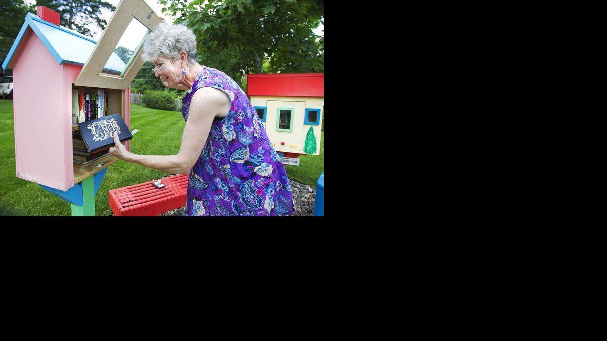 
At the Little Free Library at the home of Gwyneth Jones in Mission, she recently pulled books from the library to stamp the message, “Little Free Library, Always A Gift, Never for Sale” in each of the books. In May of 2013, Jones installed the two libraries in her front yard to honor of her parents, Jean and Ivor Jones. Her neighbors have been supportive of the Little Free Library. Recently Jones had about 100 books stolen from her libraries.
