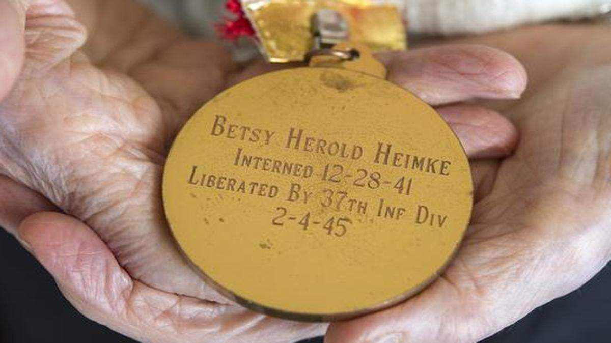 
Christmas 1941 ushered in Betsy Herold Heimke’s internment in the Philippines. This medallion from 1977 honored a reunion of internees.
