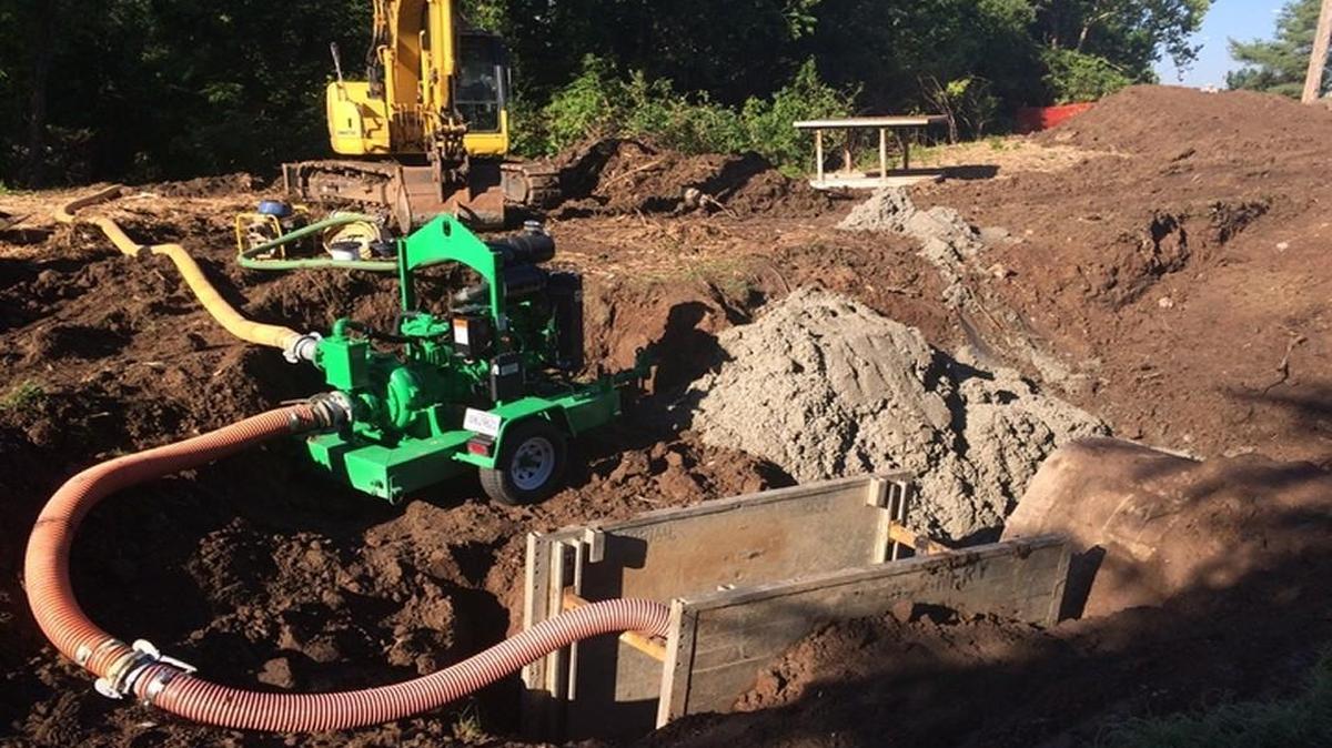 Pumping equipment was in place Friday morning near Emanuel Cleaver II Boulevard and Elmwood Avenue after sewage spilled into Brush Creek.