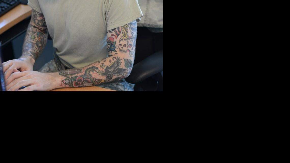 
This soldier’s tattoos don’t conform to the Army’s new regulations. Because he has “sleeves,” he probably couldn’t get a waiver if he was a potential recruit. But because he’s already in the Army, his tattoos were grandfathered in.
